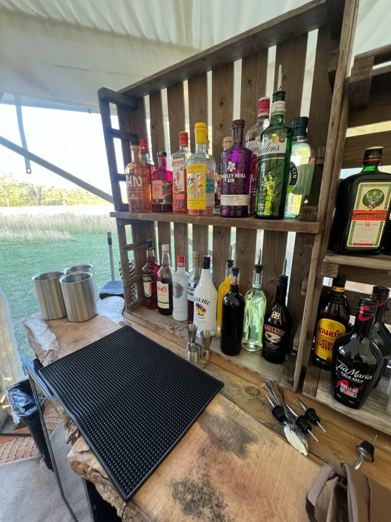 Bottles of spirits displayed on the Raise the Bar back bar