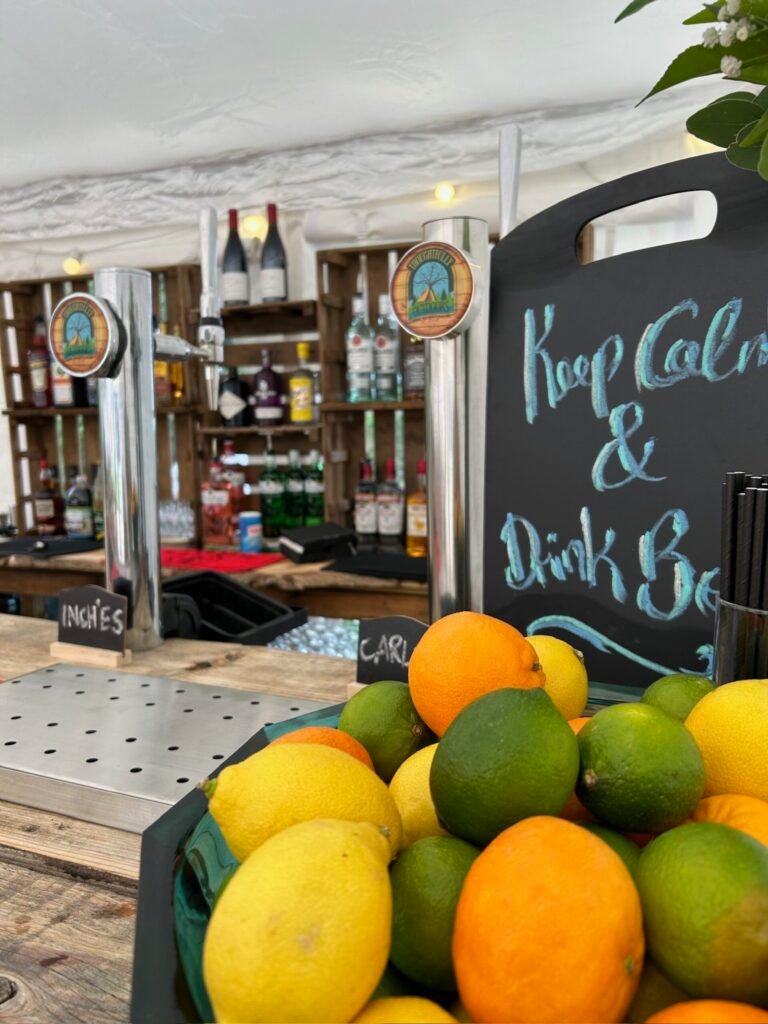 Draught beer taps and fresh citrus garnishes on the Raise the Bar counter